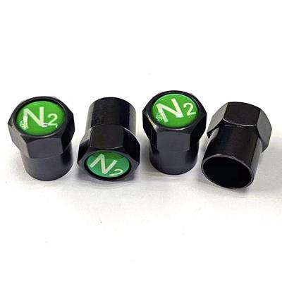 China Plastic Schrader Valve Stem Black Tire Valve Stem Cap With Green N2 Nitrogen Logo, Screw On, Hexagon Design, Insulated, Anticorrosive for sale