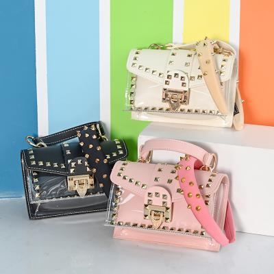 China Fashion PVC Bags Lady Shoulder Rivet Jelly Headband And Purse Solid Color Handbag Set Women Handbags for sale