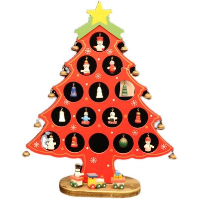 China Wooden One-Piece Wooden Hollow Christmas Tree Decorations Ornaments Mini Christmas Kindergarten Activity Desktop Gift for sale