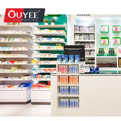 Chine Latest Customized Modern Interior Designed Pharmacy Store Customized Modern Wood Showcase Cabinet With Pharmacy Shelves à vendre