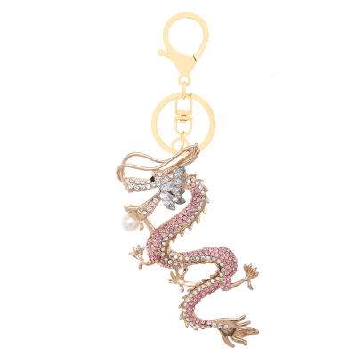 China Creative Dragon Metal Key Chains Pearl Zodiac Crystal+Metal Signs Chinese Key Chain Accessories Enamel Crystal Animal Key Chains For Bag Charm for sale