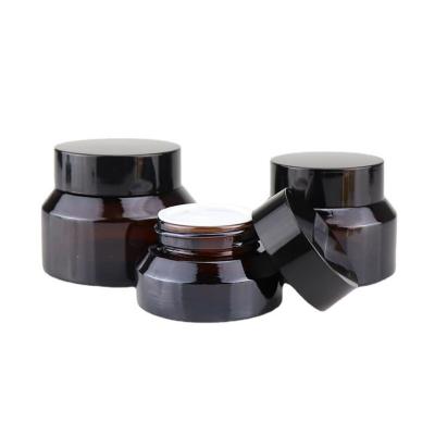 China Cream Cosmetic Wholesale Amber Glass Jar Cosmetic Jar With Gold Black Silver Lid for sale