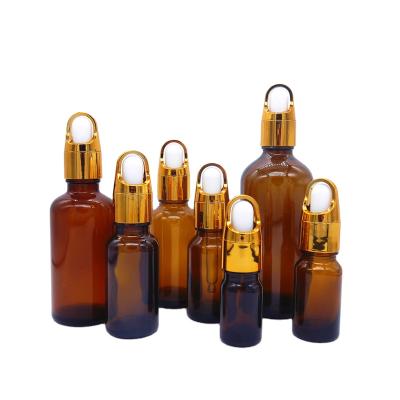 China Personal Care 10ml 15ml 20ml 30ml 50ml 100ml Gold Metallic Glass Dropper Personal Care Amber Glass Essential Oil Bottle With Dropper for sale