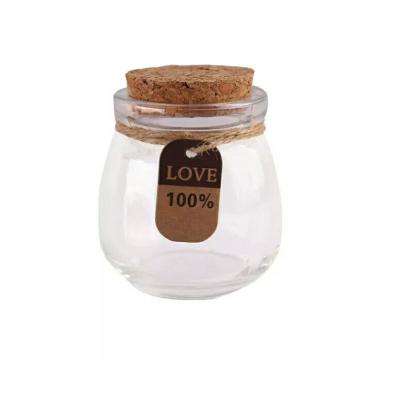 China Beverage Jars 100ml Mini Wholesale Glass Bottles With Cork Lid Pudding Yogurt Candy for sale