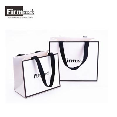 China Wholesale Paper Custom Printed White Black Trim Craft Paper Shopping Bag With Your Own Logo And Ribbon Handles for sale