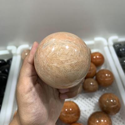 China China Wholesale Polished Natural Orange Moonstone Crystal Ball Peach Moonstone Sphere for sale