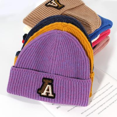 China 2021 LA warm winter letter COMMON hot sale beanie hats for women men for sale