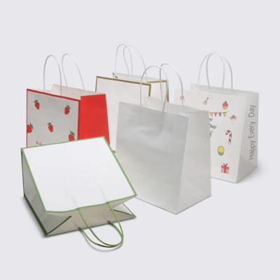 China Recycled Materials Paper Gift Bag Boutique Printed Luxury Custom Logo Gift Paper Shopping Bag for sale