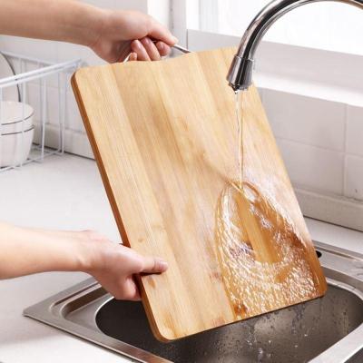 China New Arrival Eco-friendly Bamboo Kitchen Cutting Board Organic Bamboo Cutting Plate With Handle For Cutting Food for sale