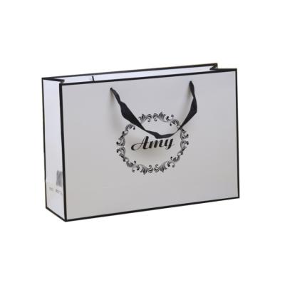 China Custom Logo Print Luxury Paper Shopping Design Low Cost Recyclable White Ribbon Handle Gift Carrier Bag for sale