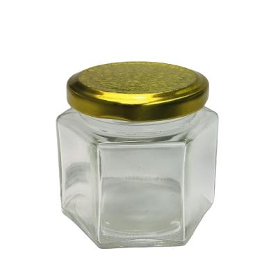 China Food Industry Wholesale 120ml Hexagon Food Jam Honey Jar Glass Making With Metal Hook Lid for sale