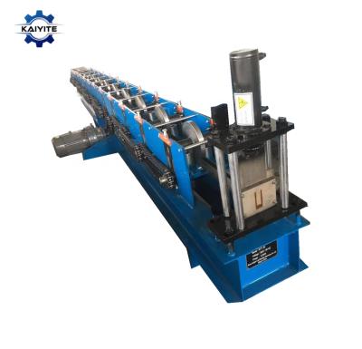 China Building Material Stores U Guide Rail Roll Forming Shutter Door Steel Tile Cutting 15 Hydraulic Stations 8-12m/min By Chain 1-2mm 7.5kw 18mm for sale