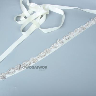 China Modern Gorgeous Luxury Design Diamante Rhinestone Flower Wedding Sash Bead Pearl Wedding Dress Sash New Bridal Customize for sale