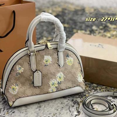 China Water Resistant 2022 Small Daisy Print Series Quality fashion ladies handbags women hard shell shape bag for sale