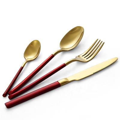 China Durable Handle Red And Black Gold Plated Forged Stainless Steel Spoon for sale