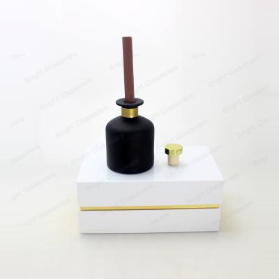 China Classic Matte Black Colored Round 100ml 200ml Diffuser Glass Bottles With Cork Stopper Gift Packing Box for sale