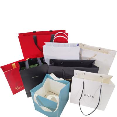 China Recyclable Custom Design Ribbon Paper Bag Luxury Jewelry Cosmetic Gift Apparel Shopping Art Packaging Bag for sale