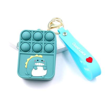 China 2021 New Mini Bubble Sensory Silicone Wallet Kids Decoration Case Poppings Person Key Chain Toy Bag Coin Purse for sale