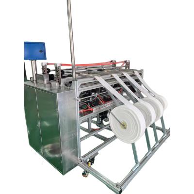 China Textile industry fully automatic coreless high efficiency bandage roll winding machine for sale