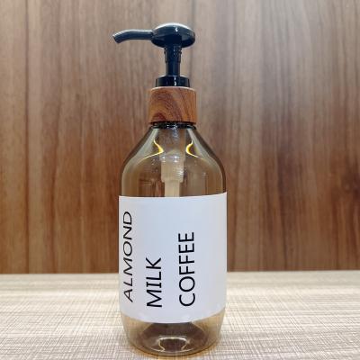 China Personal Care Light Blocking Translucent Plastic Bottles , Empty PET Shampoo Body Wash Pump Packaging Bamboo Wooden Bottle for sale