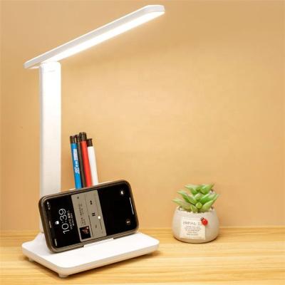 China 2022 Modern New Design Batter Rechargeable Contact Dimming Desk Lamp With Pen Holder Desk Study Reading Table Lamp for sale