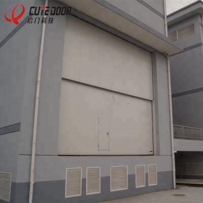 China Electric Overhead Steel Door Vertical Lifting Windproof Counterbalance Sectional Industrial Doors for sale