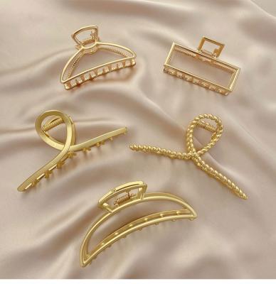 China Simple Wholesale Metal Hair Clips Gold Metal Hair Claw Pins Accessory Large For Women Girls for sale