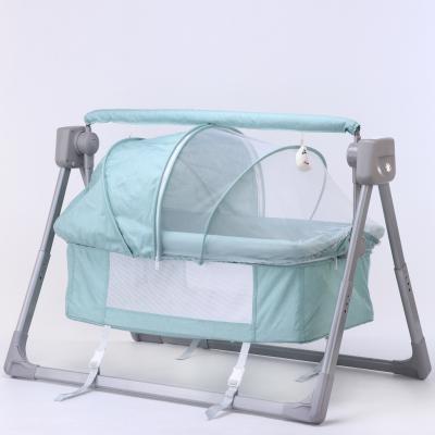 China Simple Electronic Baby Crib Movable Crib Stand Musical Swing Crib for sale