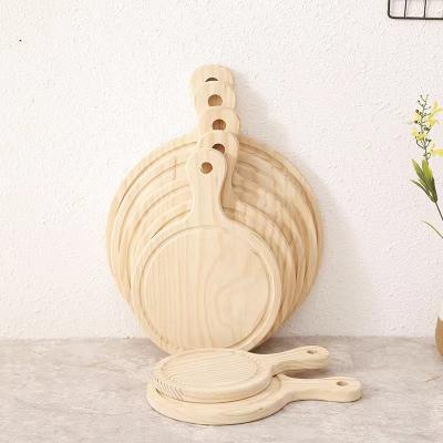 China Sustainable Bread Fruit Vegetable Bakeware Tool Cheese Serving Round 10 11 Inch Round Wood  Tray Plate Wooden Pizza Board With Handle for sale