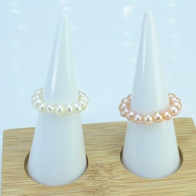 China Hot Selling New Design Adjustable Bead Romantic Curved Napkin Ring Pearl Ring Triple Beaded Arrangement for sale