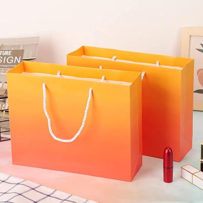 China Recycled Materials 300gsm Orange Design Customized Luxury Small Paper Bag Boutique Jewelry Wedding Gift Shopping Paper Bags With Your Own Logo for sale