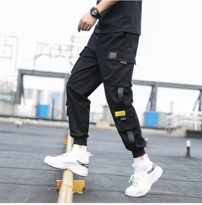 China 2021New Anti-wrinkle Fashion Streetwear Ribbons Black Side Cargo Harem Pants Pockets Hip Hop Joggers Casual Pants Men for sale