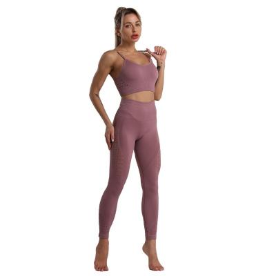 China Breathable Popular Seamless Sports Hollow Fitness Bra Set Hip Pants Tight Hip Lifting Mesh Yoga Suit Bra And High Waist Fitness Leggings for sale