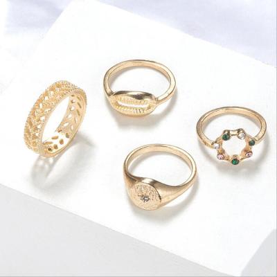 China TRENDY 4pcs/set Gold Finger Leaf Ring Cavity Alloy Metal High Quality Shell With Round Geometry Design Jewelry For Women for sale