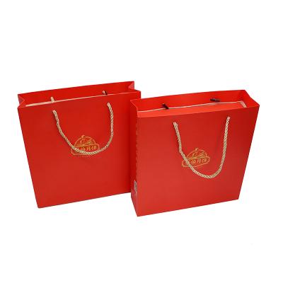 China Quality Biodegradable Custom Logo Warranty Free Sample Luxury Special Paper Bag With Ribbon For Party Bags for sale