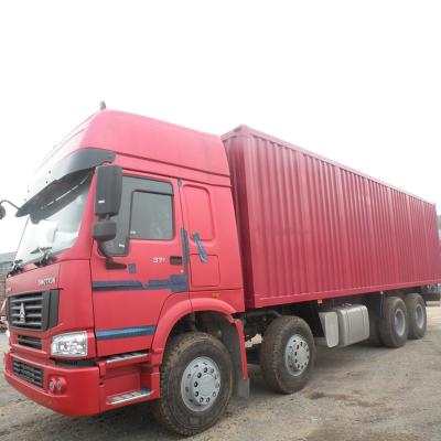 China SINOTRUK HOWO 8X4 371HP 35T CONTAINER VAN TRUCK CARGO TRUCK RED COLOR ZZ1317N4667W 12000*2500*3850 for sale