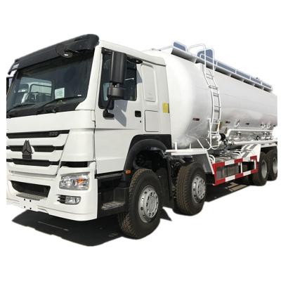 China SINOTRUK HOWO 8X4 371HP 28CBM BULK CEMENT TANKER TRUCK MODEL ZZ1317N4667W 400L diesel tank for sale