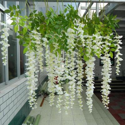 China Gardening Display Hot Selling Artificial White Wisteria Flower Vines Wall Foliage Wedding Decoration Garland Hanging Plants for sale