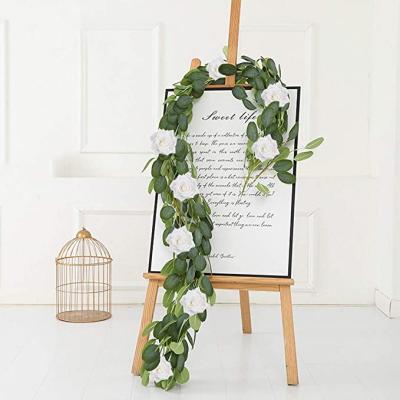 China Beautiful Colorful Patient Eucalyptus Garland White Rose Flowers Eucalyptus Garland Vines For Wedding Party Home Decoration for sale