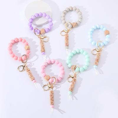 China 2022 Promotion Gift Custom Silicone Beads Elastic Bracelet Key Chain MOM Tassel Silicone Beads Bracelet Bangle KeychainHot Selling Products for sale