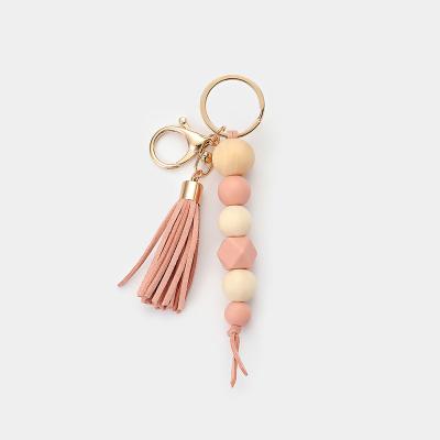 China Silicone Tassel Key Chain Party Handcrafted Pocket Wooden Gift / Accessory for sale