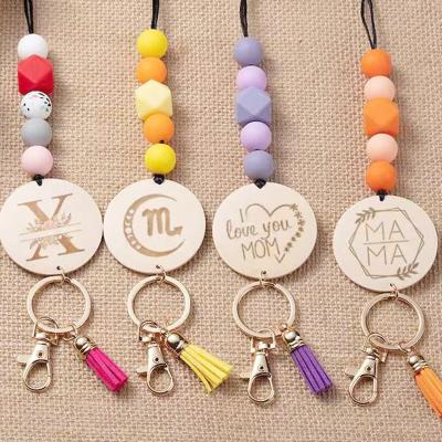 China TRENDY Letter Charm Beaded Disc Inscription Silicone Tassel Key Chain Teacher ID Lanyard for sale