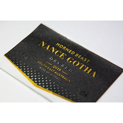 China Waterproof Custom Adhesive Roll Printed Glossy Silver Paper Label For Vodka Whiskey for sale