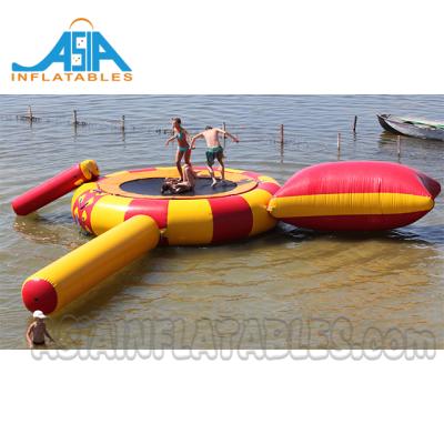 China 0.9mm PVC tarpaulin commercial grade inflatable water trampoline with catapult drop slide for adults and children for sale