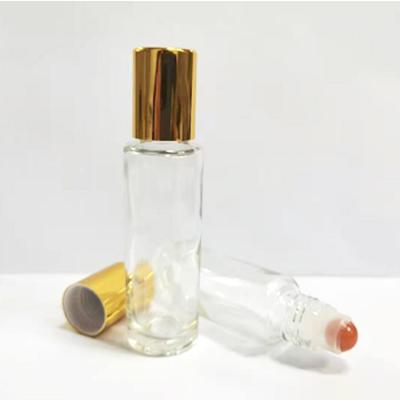 China Personal Care 15ml Roll On Bottle Transparent Bottle With Gold Cap Cap Metal Plastic Ball for sale