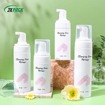 China PET Round Face Cleanser Bottles , Plastic Hand Soap Pump Bottles With Silicone Brush for sale