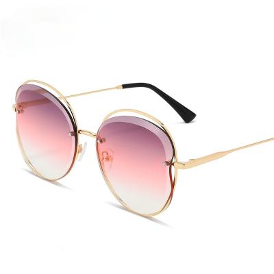 China Fashion sunglasses best rate European and American fashionable metal rimless women's sunglasses for sale