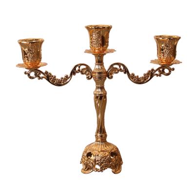 China Hot Sale Luxury Decor Light Candlestick Metal Vintage Embossed Candlestick Holder for sale