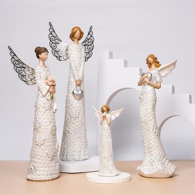 China New Europe Figurines Resin Crafts Angel Combination Bouquet Design Character Border Creative Modeling for sale