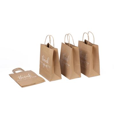 China Recycled Materials Kraft Paper Twist Handle Christmas Gift Bag Promotional Paper Handle Bag for sale